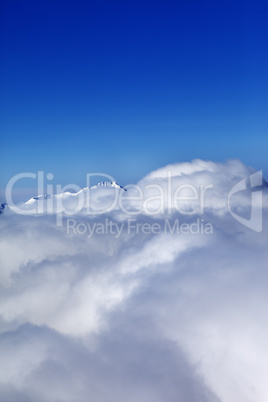 Mountains under clouds at sun day