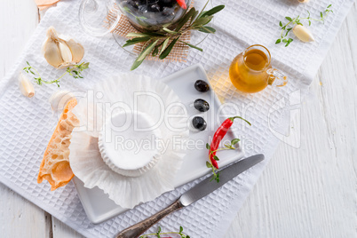 soft cheese with spicy olives