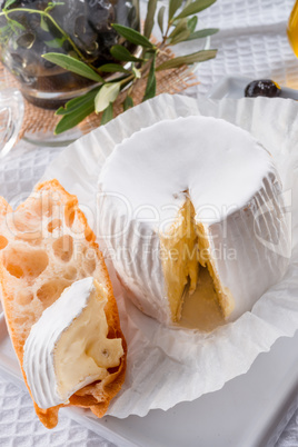 soft cheese with spicy olives