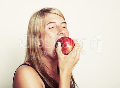 Woman biting into apple