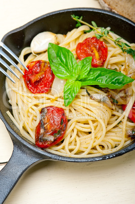 spaghetti pasta with baked cherry tomatoes and basil