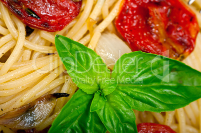 spaghetti pasta with baked cherry tomatoes and basil