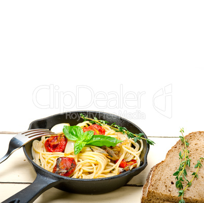 spaghetti pasta with baked cherry tomatoes and basil