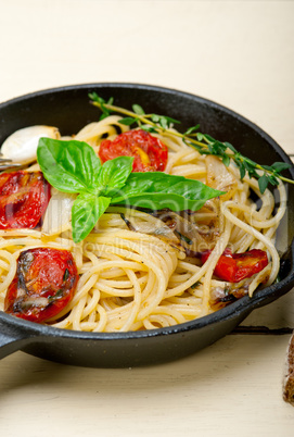 spaghetti pasta with baked cherry tomatoes and basil