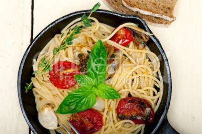 spaghetti pasta with baked cherry tomatoes and basil