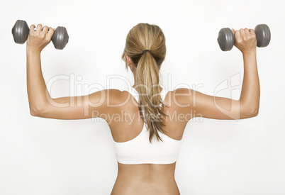 Woman exercising with dumbbells