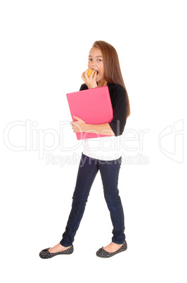 Blond girl eating apple.