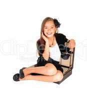 Young girl in briefcase.