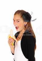 Girl eating banana.