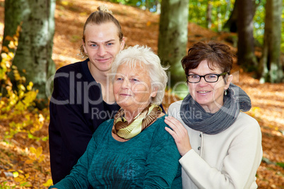 Portrait generations, man and two women in the park
