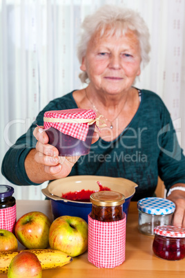 Granny proudly displays her homemade jam