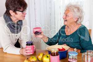 Two women talk about the homemade jam