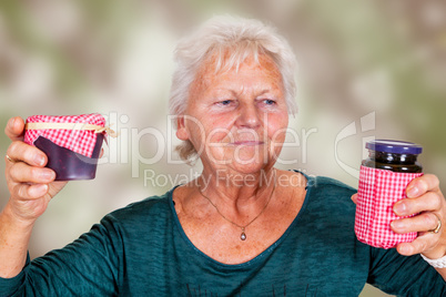 Grandma holds up her homemade jam