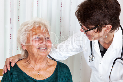 Doctor talking with elderly woman