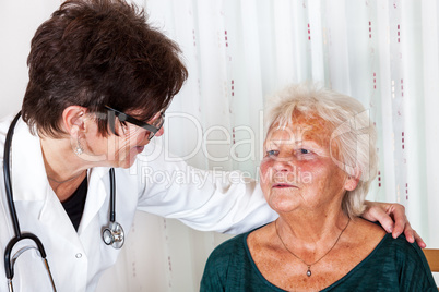 Doctor talking with elderly woman