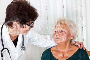 Doctor talking with elderly woman