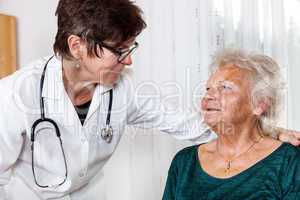 Doctor talking with elderly woman