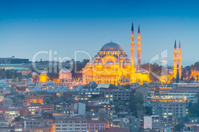 Mosque in Istanbul illuminated at dusk, aerial view