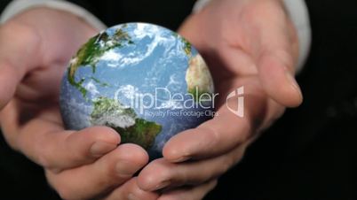 ROTATING CLOSE EARTH GLOBE IN HANDS