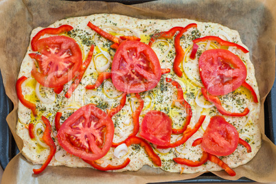 Delicious fresh traditional Italian focaccia bread uncooked