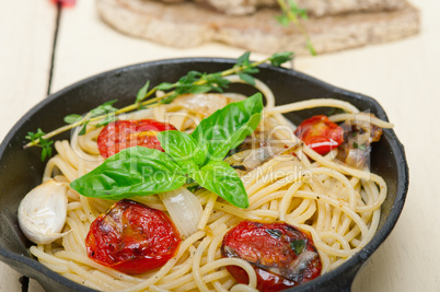 spaghetti pasta with baked cherry tomatoes and basil