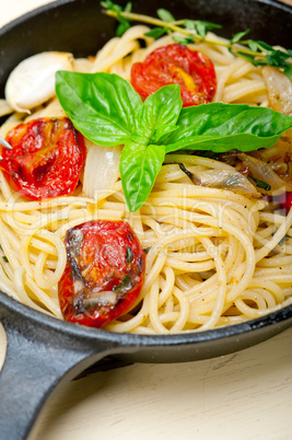 spaghetti pasta with baked cherry tomatoes and basil