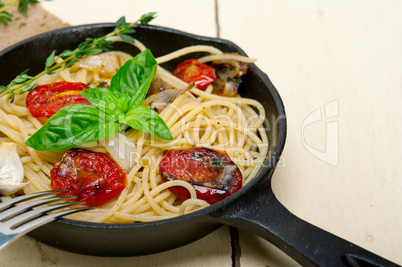 spaghetti pasta with baked cherry tomatoes and basil