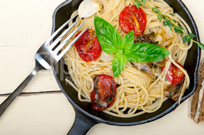 spaghetti pasta with baked cherry tomatoes and basil