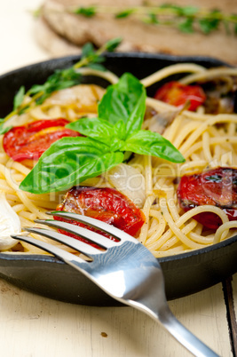 spaghetti pasta with baked cherry tomatoes and basil