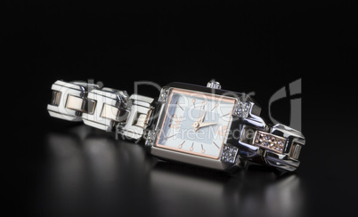 photo luxury woman?s watch on black