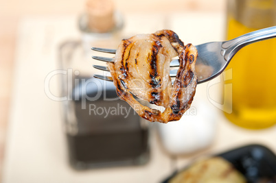 grilled onion on a fork