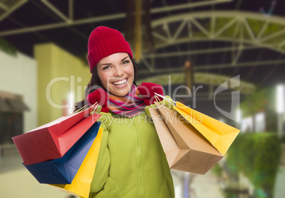 Warmly Dressed Mixed Race Woman with Shopping Bags