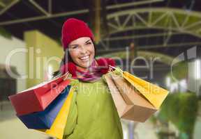 Warmly Dressed Mixed Race Woman with Shopping Bags