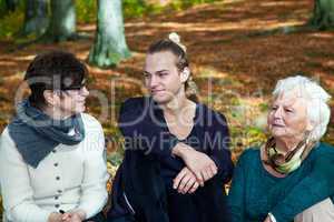 Three generations in autumnal park