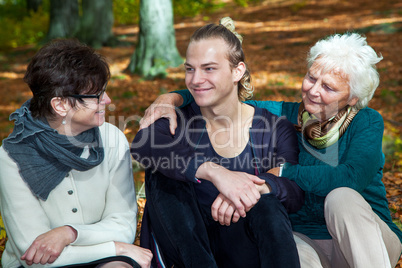 Three generations in autumnal park