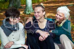 Three generations in autumnal park