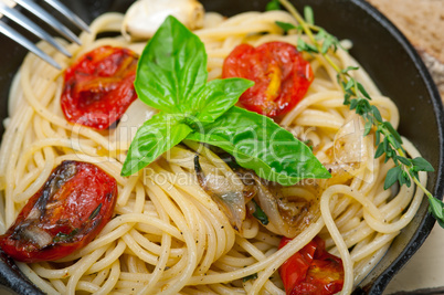 spaghetti pasta with baked cherry tomatoes and basil