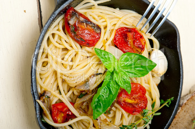 spaghetti pasta with baked cherry tomatoes and basil