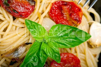 spaghetti pasta with baked cherry tomatoes and basil