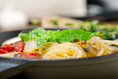 spaghetti pasta with baked cherry tomatoes and basil