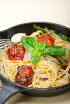 spaghetti pasta with baked cherry tomatoes and basil