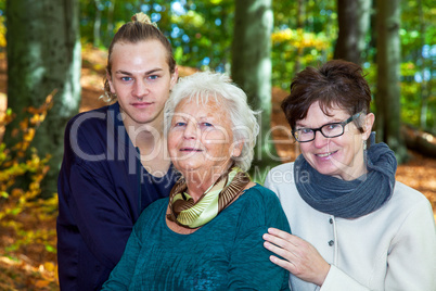 Three generations in autumnal park