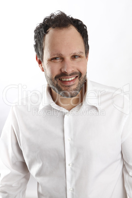 Attractive man with white shirt  looks into the camera