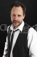 Attractive  man with white shirt and black tie looks into the ca