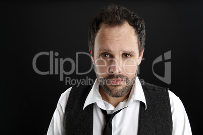 Attractive  man with white shirt and black tie looks into the ca