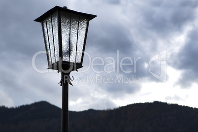 Street lamp in front of mountains