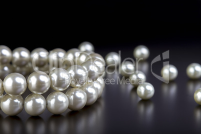 white pearls necklace on black