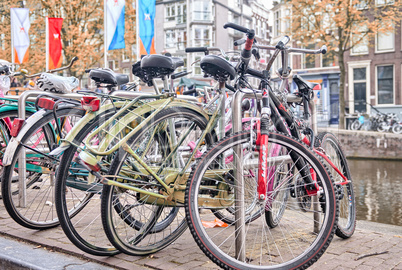 Bicycles lining a bridge over the canals of Amsterdam, Netherlan