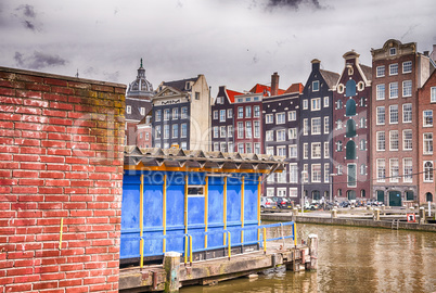 Amsterdam. Wonderful view of city canals and buildings in spring