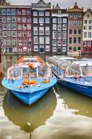 Amsterdam. Wonderful view of city canals and buildings in spring